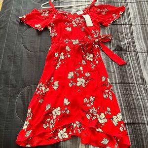 Red color and flowers. suit reaches knees